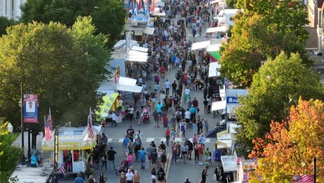 Crowds-of-people-on-American-street-during-carnival-fair-in-autumn