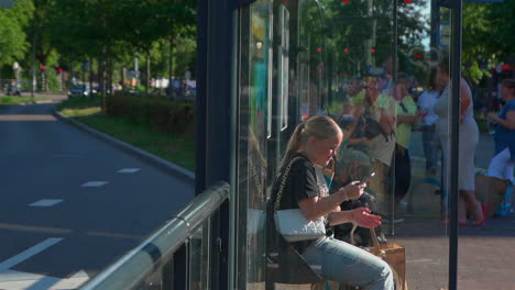 Video-features-a-teenage-girl-using-her-phone-to-leave-a-voice-message-at-a-public-bus-station