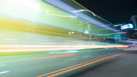 Timelapse-Sungnyemun-gate-or-Namdaemun-gate-with-light-trails-of-cars-passing-crossroads-at-night-in-Seoul,-South-Korea