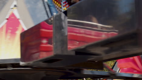 Static-shot-of-young-children-enjoying-themselves-on-a-carnival-ride