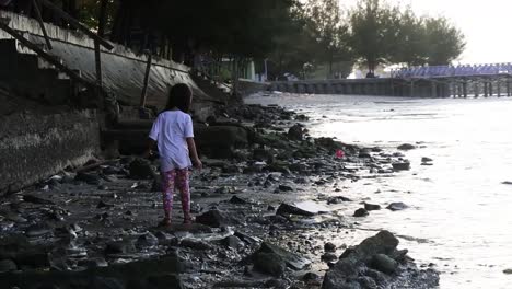 Rembang,-Indonesia--September-2,-2022:-girl-playing-around-Kartini-beach