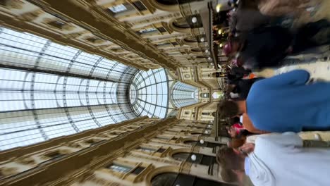 Vertical-phone-shot-people-in-Galleria-Vittorio-Emanuele-II-in-Milan