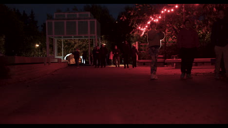 Low-static-shot-filming-people-leaving-the-Reflektor-Malmi-event