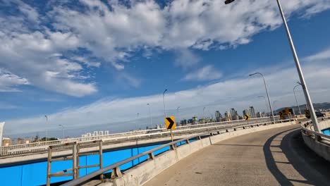 Driver's-POV-driving-on-Seoul-bridge-road-crossing-Dongjak-bridge-on-a-summer-day,-South-Korea