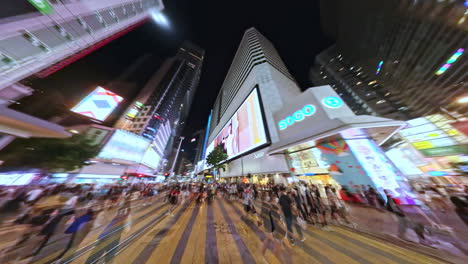 Hyperlapse-shot-of-people-walking-on-the-streets-on-outside-of-SOGO-in-Causeway-Bay,-Hong-Kong,-China-at-night-time