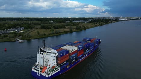 Aerial-Orbit-Motion-Around-Stern-Of-BG-Onyx-Cargo-Container-Ship-Sailing-Along-Oude-Maas-Through-Zwijndrecht