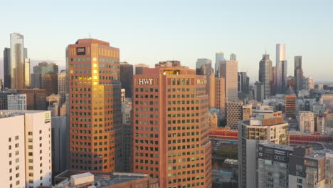 Aerial-accent-looking-over-Melbourne-CBD-with-classic-architecture-in-the-foreground-during-beautiful-dawn-morning