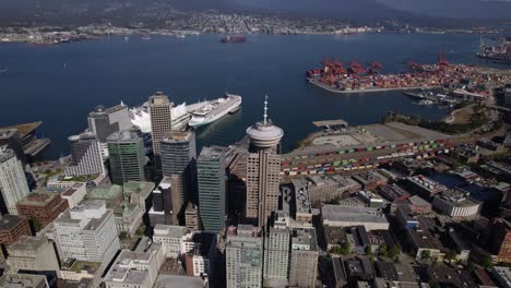 Aerial-view-towards-the-Vancouver-Lookout-tower,-in-BC,-Canada---tilt,-drone-shot