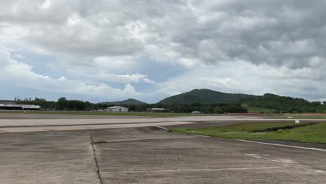 Airplane-departure-takeoff-flight-in-slowmotion-from-airport-in-raining-day