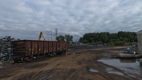 Truck-driving-backwards-on-a-dirtroad-in-between-the-construction-machines-in-Indiana,-USA