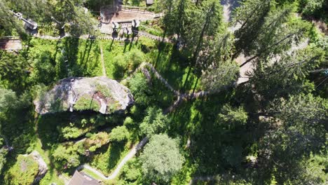 Ascending-birdseye-aerial-looking-straight-down-at-high-rope-and-zipline-park-in-Voss-Norway---Summer-aerial-view