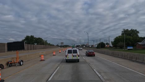 POV-truck-stopping-in-the-middle-on-the-highway-lane-and-driving-slowly-forward-because-of-road-works