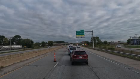 Cars-driving-carefully-on-the-american-highway-in-Gary,-Indiana,-USA