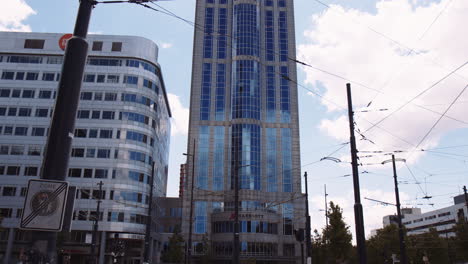 Tilting-upward-shot-showing-the-dark-blue-stained-glass-business-office-in-downtown-Rotterdam