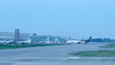 View-Of-Airplanes-Moving-Around-Terminal-1-At-El-Prat-Barcelona-Airport,-Spain