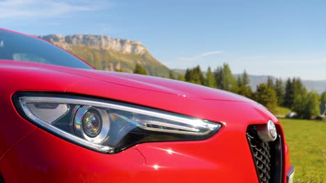 Alfa-Romeo-logo-in-the-front-of-the-car-in-Alpes-French