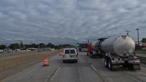 Slow-motion-driving,-trucks-and-cars-passing-by-on-the-right-lane-of-the-highway