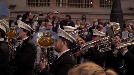 Uniformed-marching-band-during-a-religious-procession-in-Madrid,-Spain