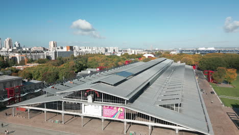 Facade-of-Grande-Halle-de-la-Villette-and-cityscape,-Paris-in-France