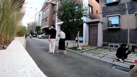 People-in-daily-life-Bukchon-Hanok-village-traditional-cultural-street-in-downtown-Seoul,-South-Korea