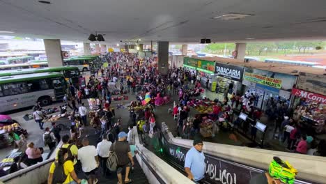 Busy-crowded-public-bus-terminal-station-during-rush-hour-in-Brasilia,-Brazil