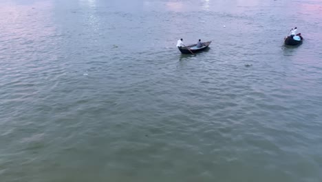 POV-Going-Past-River-Boat-Taxis-And-Fisherman-In-Sylhet