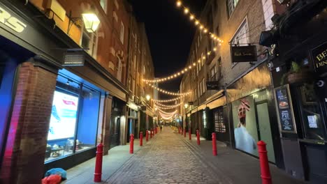 Beautiful-and-cute-street-with-fairy-lights-in-London-at-night,-England