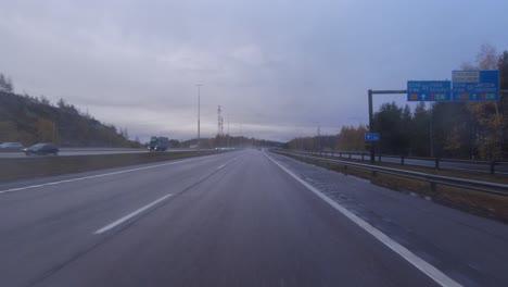 Driving-along-the-highway-in-Helsinki-and-filtering-with-other-cars