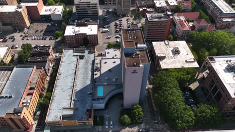 Aerial-view-around-the-Hilton-hotel-in-downtown-Knoxville,-in-sunny-Tennessee,-USA---circling,-drone-shot