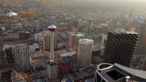 Calgary-tower-and-highrise-in-downtown,-golden-hour-in-Alberta,-Canada---Aerial-view