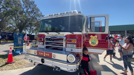 Red-Fire-Fighting-Truck-On-Display-at-Fire-Safety-Event,-Closeup-Detail,-For-The-Public-to-Get-hand-on-Experience-and-Take-Photos-in-Tampa-Bay,-Florida