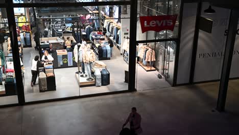 Getting-some-Levi-Jeans-within-Battersea-Power-Station,-London,-United-Kingdom