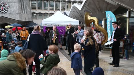 People-Dancing-Outside-Of-The-City-Of-London-Building-Office,-United-Kingdom