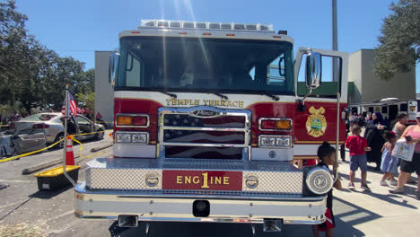 Red-Fire-Fighting-Vehicle-On-Display-in-Front-View,-Closeup-Detail,-At-a-Demonstration-For-The-Public-At-a-Fire-and-Safety-Event-in-Tampa-Bay,-Florida