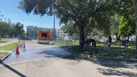 Children-being-shown-how-to-use-a-firefighter-house-at-a-public-open-house-event-on-fire-and-safety-on-a-sunny-day-in-Tampa-Florida,-USA