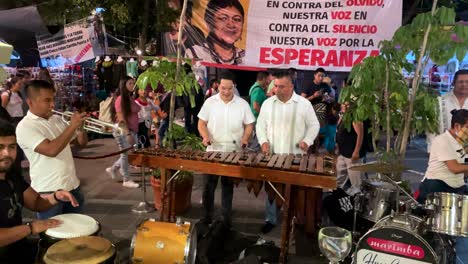 slow-motion-shot-of-a-musical-group-a-in-the-center-of-the-city-of-oaxaca