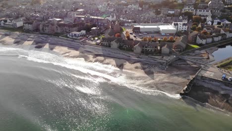 Drone-shot-flying-into-Stonehaven-in-Scotland,-UK