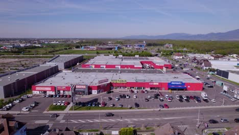 Aerial-view-of-an-industrial-shopping-complex-Dynamic-Establishing-Aerial