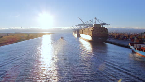 Aerial-view-following-San-Francisco-Alameda-ferry-leaving-wake-in-shimmering-Oakland-estuary