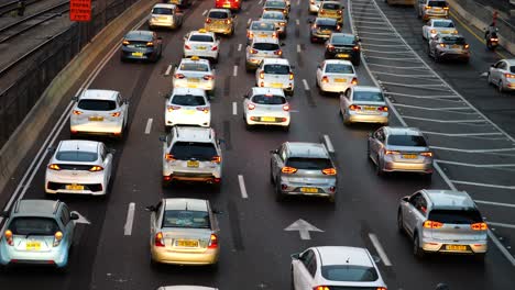 Slow-moving-car-traffic-lines-on-a-highway,-back-view