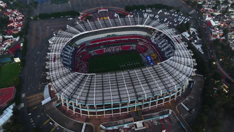 Aerial-view-in-front-of-the-Estadio-Azteca-stadium,-in-Mexico-City---rising,-tilt,-drone-shot