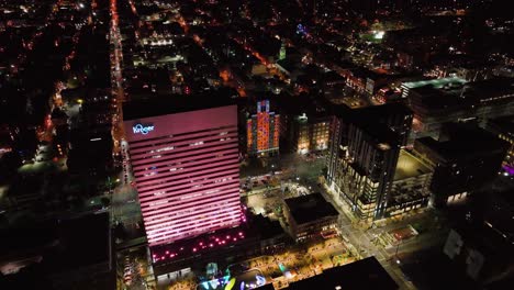 Aerial-view-towards-a-Illuminated-building-wall,-during-BLINK-the-festival-of-light-and-art-in-Cincinnati,-Ohio,-USA