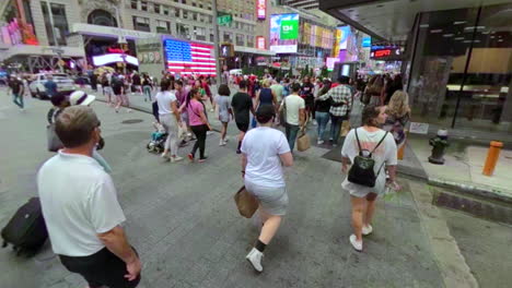 Crossing-a-crowded-street-in-Manhattan-towards-Times-Square-in-New-York