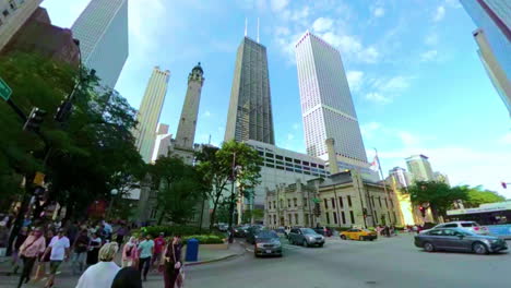 Crossing-the-street-in-downtown-Chicago-and-looking-at-skyscrapers-in-Magnificent-Mile