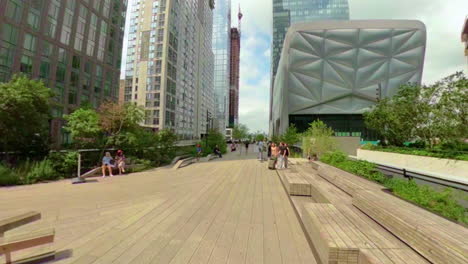 Walking-the-High-Line-in-New-York-with-bunch-of-people-passing-by-on-a-summer-midday