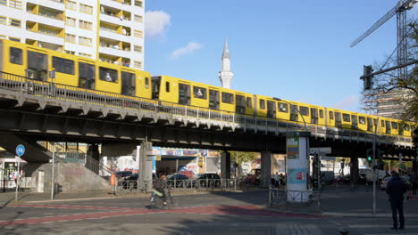 Yellow-Metro-in-Front-of-Mosque-at-Kottbusser-Tor-in-Berlin-Kreuzberg