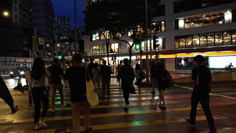 camera-follows-people-crossing-zebra-cross-at-night