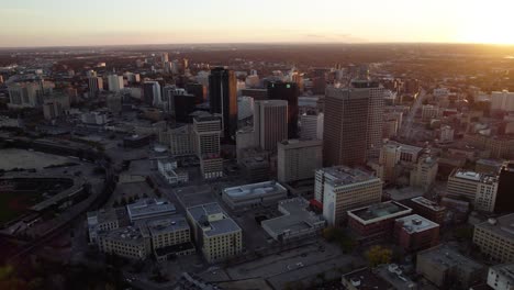 Aerial-view-around-the-city-center-of-Winnipeg,-during-a-colorful,-autumn-evening-in-Canada---orbit,-drone-shot