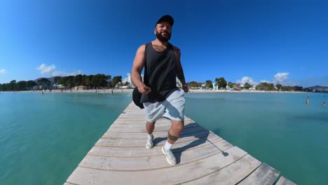 360-camera,-man-running-on-the-jetty