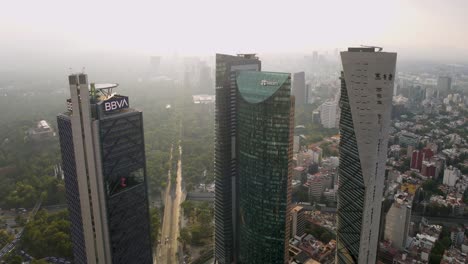 Aerial-view-of-BBVA-and-other-financial-buildings-in-Mexico-City-in-epic-shot-under-scenic-sunlight